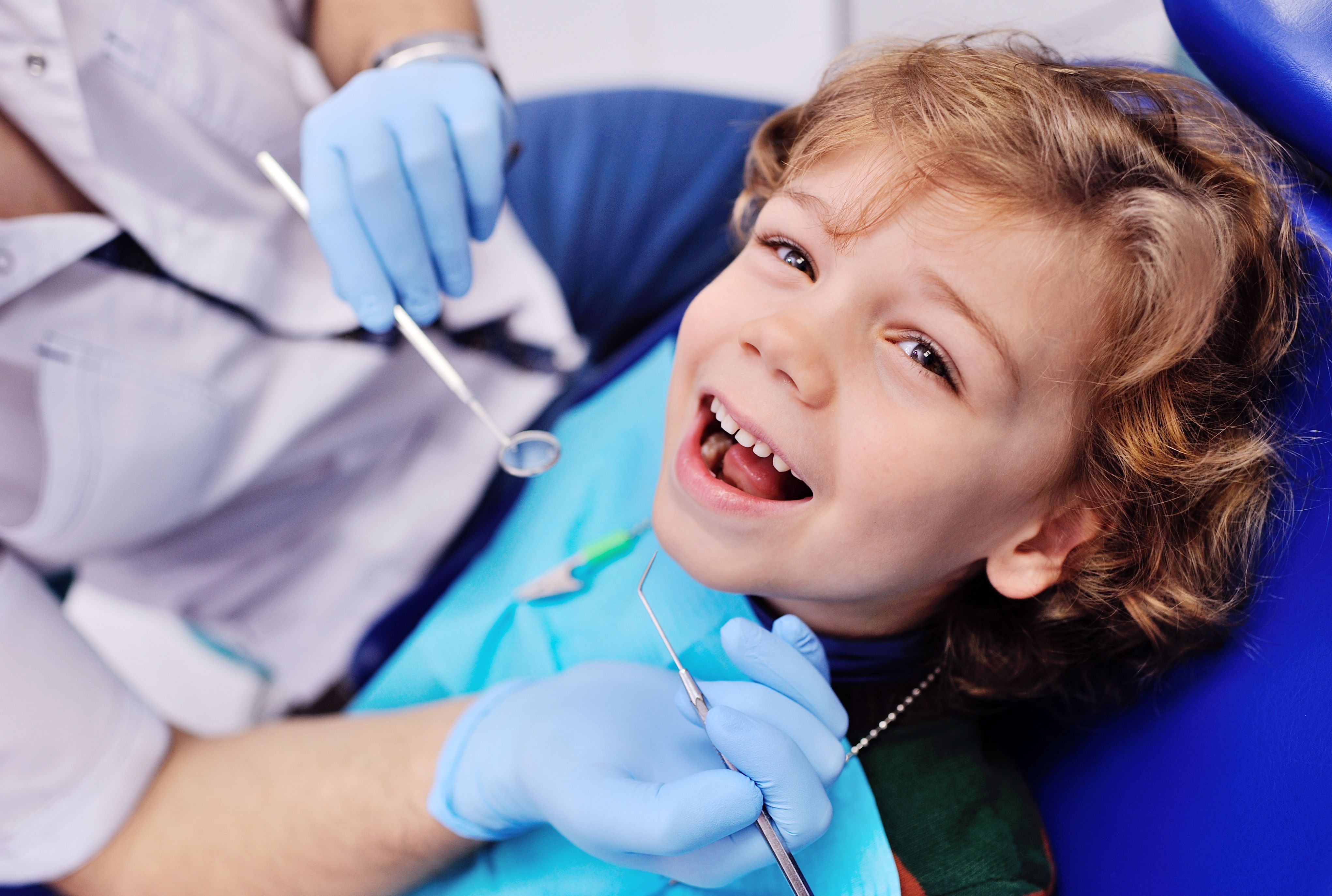 A child laughing at the dentist office.
